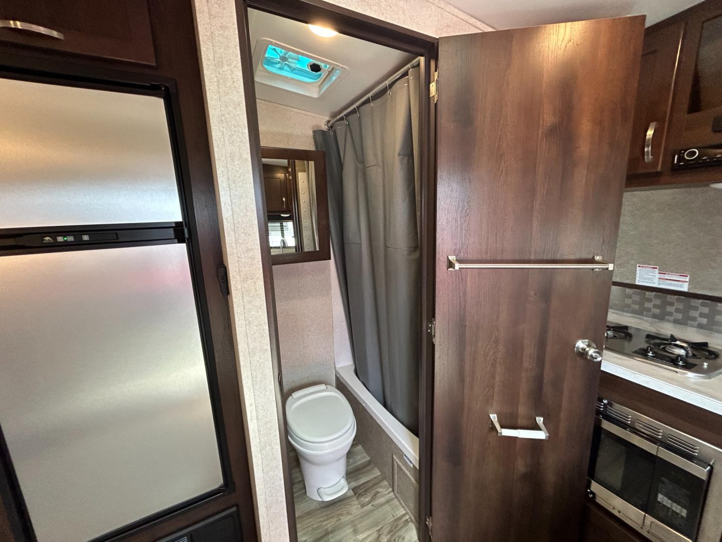 2018 Silver JAYCO OCTANE (1UJBJSBJXJ1) , located at 17760 Hwy 62, Morris, OK, 74445, 35.609104, -95.877060 - 2018 JAYCO OCTANE SUPER LITE 161 TOYHAULER IS 16FT, FEATURES STAINLESS STEEL APPLIANCES, SEAMLESS COUNTERTOPS, SPRING ASSIST REAR RAMP DOOR, SLIDE DOWN SCREEN DOOR, REAR ELECTRIC QUEEN BED WITH ROLLOVER SOFA, TUB/SHOWER COMBO, INTERIOR/EXTERIOR SPEAKERS, OUTSIDE SHOWER, AND AN OUTSIDE FILL UP STATIO - Photo#17